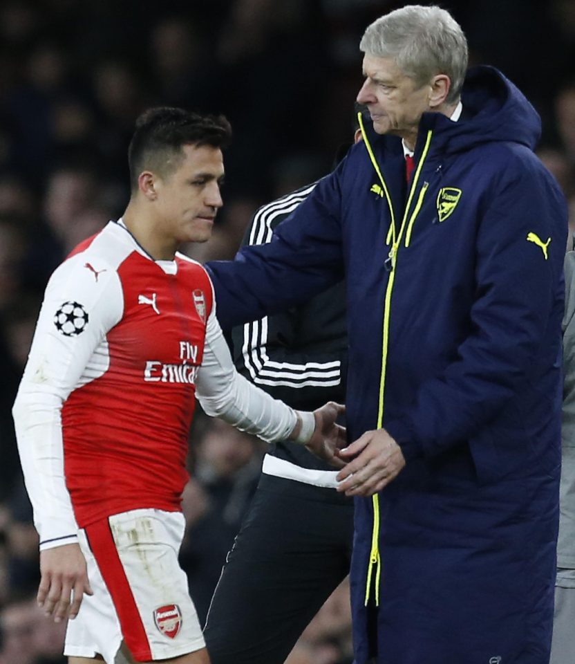  Arsene Wenger greets Alex Sanchez as the Chilean is subbed off in the humiliation against Bayern Munich