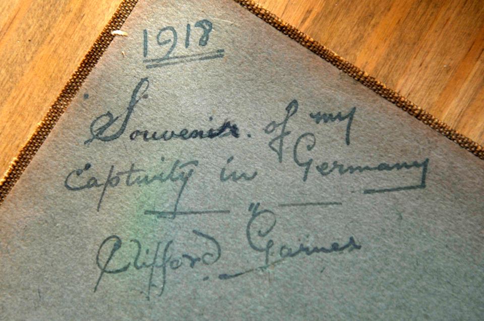  The album dated 1918 was signed by Clifford and read 'Souvenirs of my captivity in Germany'