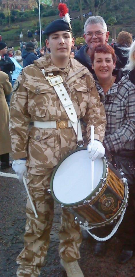  Proud . . . Mum Lyn and stepdad Ian with Lee at homecoming parade on his return from Afghanistan