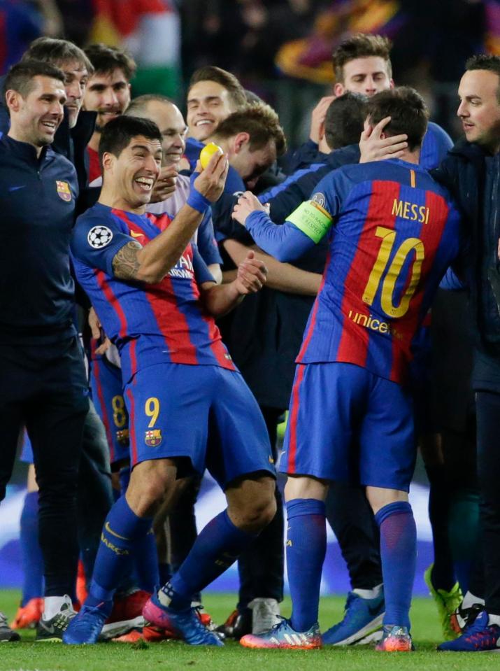  Luis Suarez, who scored his sides first goal that seemed an age ago, celebrates with Lionel Messi