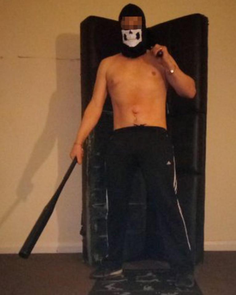  The sinister admirer poses topless with his face hidden by a mask and wielding a baseball bat on his Twitter profile