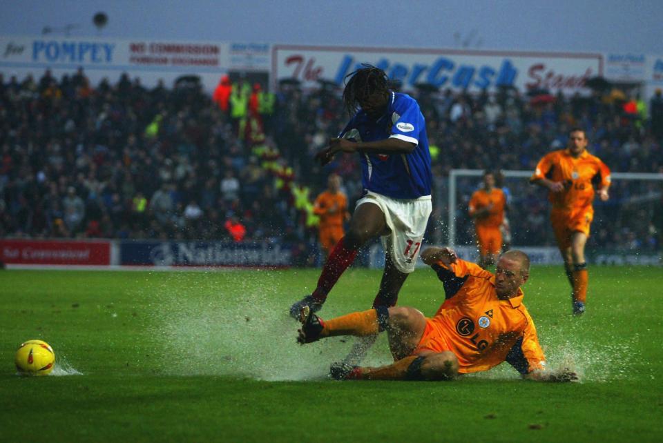  Vincent Pericard of Portsmouth is tackled by Leicester's Matt Elliott