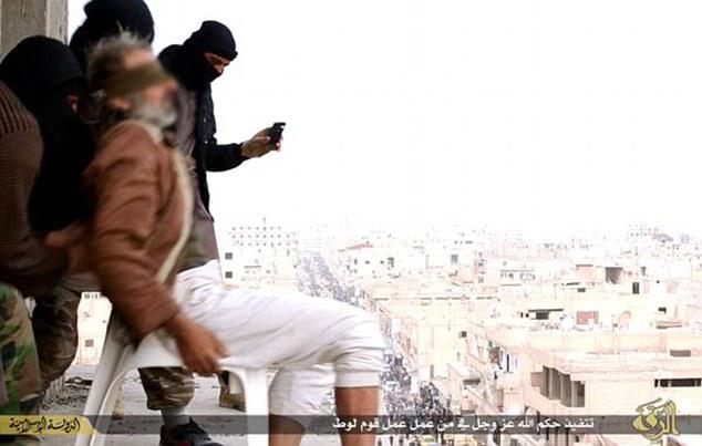  A victim is forced to the ledge by the murderous jihadis