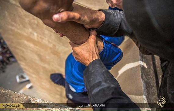  A man accused of being gay is held over the ledge of the building. File picture