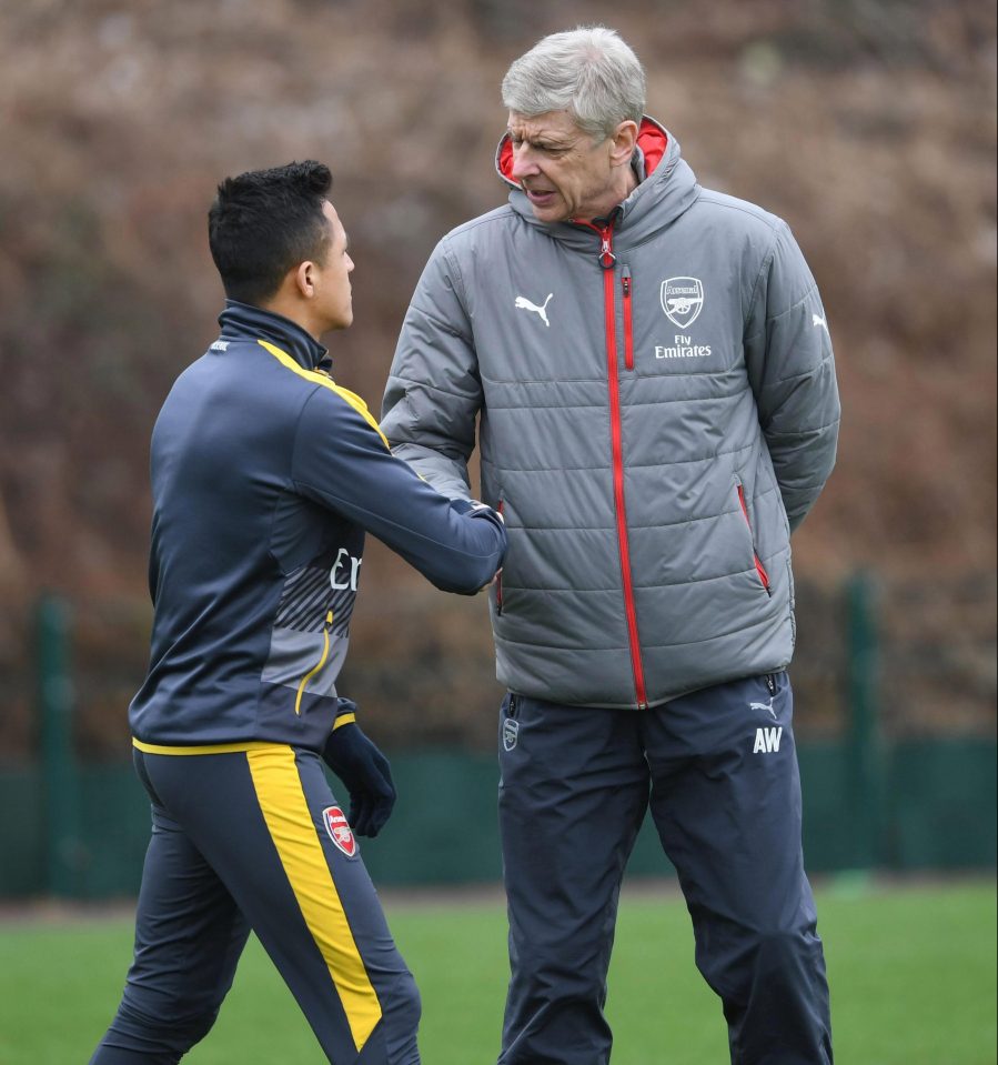  Alexis Sanchez and Arsene Wenger shake hands in training after bust up