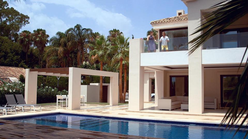  Charlie Mullins and presenter Katherine take in the view while looking around a villa he's thinking of buying