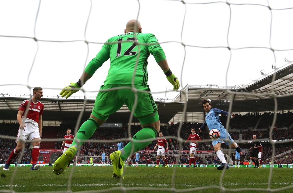  David Silva latches onto the loose ball to volley past Brad Guzan