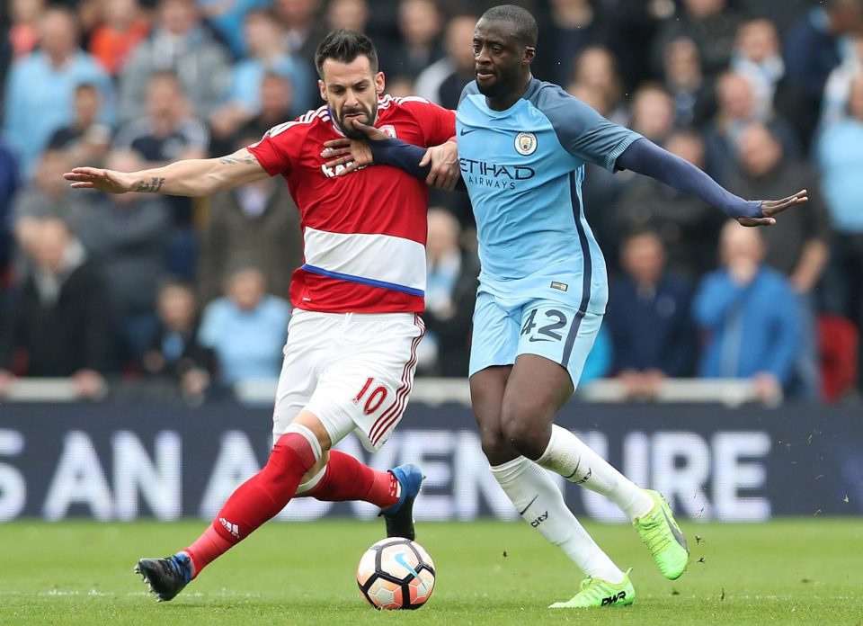  Alvaro Negredo tries to muscle Yaya Toure off the ball