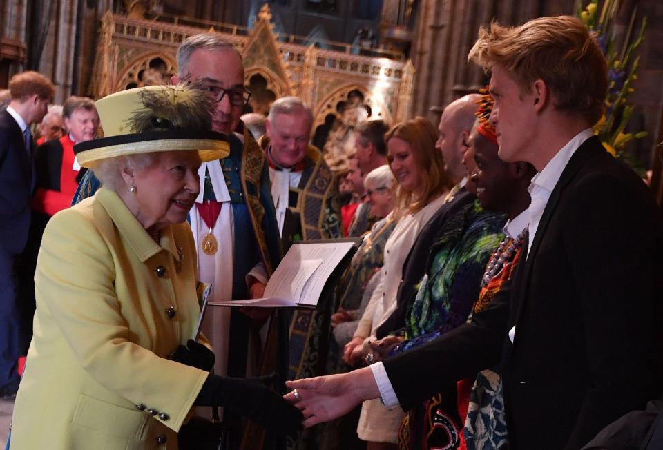  The Queen shook hands with Aussie heartthrob Cody Simpson, right, as she left Westminster Abbey after the service