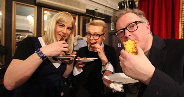  Admirers have a munch on the mammoth bake