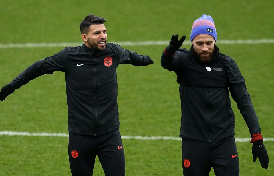  Sergio Aguero and fellow Argentinian Nicolas Otamendi warm up