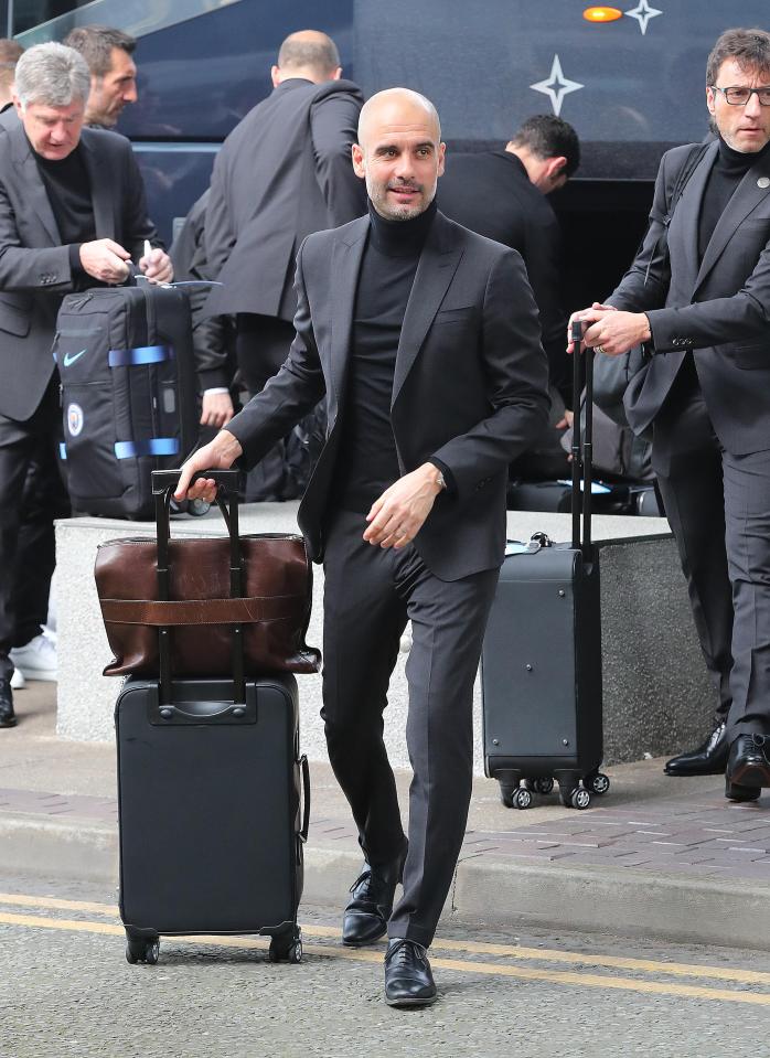  Manchester City boss Pep Guardiola cuts a dash in his club suit