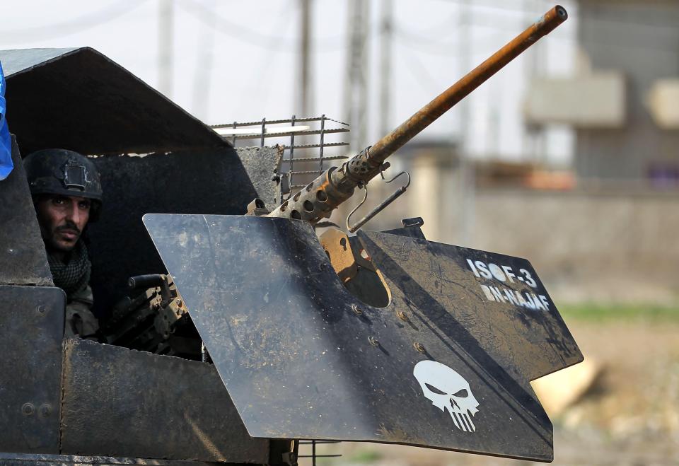  A member of Iraq's elite Counter-Terrorism Service in an armed vehicle in Mosul