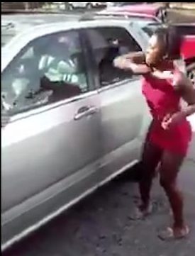  The rampaging woman smashes her ex's car in the frenzied attack