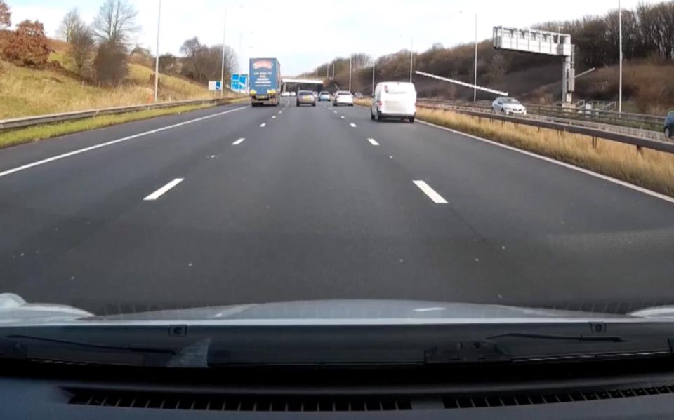  One of the poles can be seen flying towards Danny's car in a hair-raising near-miss