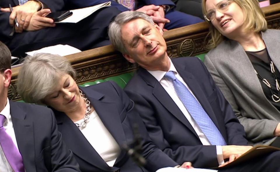  Sleeping on it . . PM and Hammond appear to doze in Commons