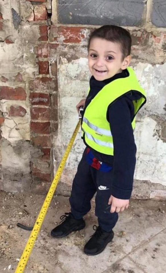  Little Bradley was all smiles as he went to help his dad just two weeks before his next cancer treatment