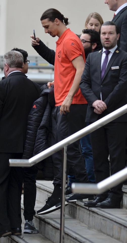  Zlatan Ibrahimovic held his coat as fans tried taking a picture