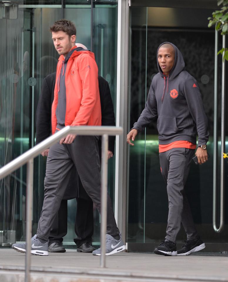  Ashley Young had his hood up as he followed Michael Carrick out of the hotel