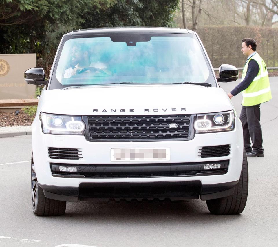  Hotshot striker Diego Costa looked happy in a white version with a black roof