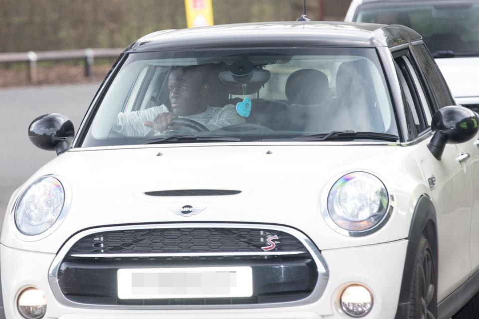  N'Golo Kante looks pleased as punch in his little Mini