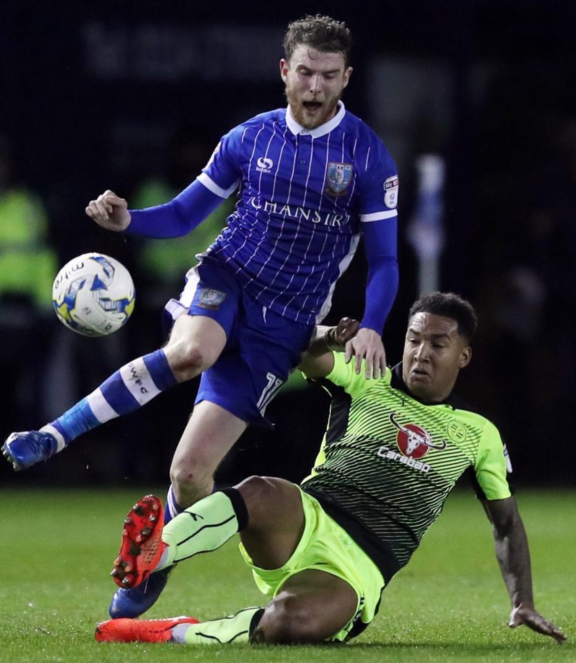  Sam Winnall battles it out with Reading's Liam Moore