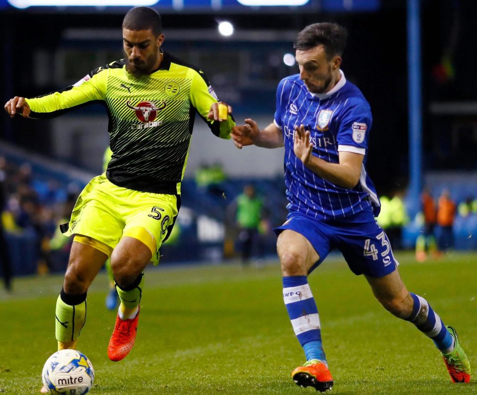  Reading's Lewis Grabban takes it down the line against Wednesday's Morgan Fox