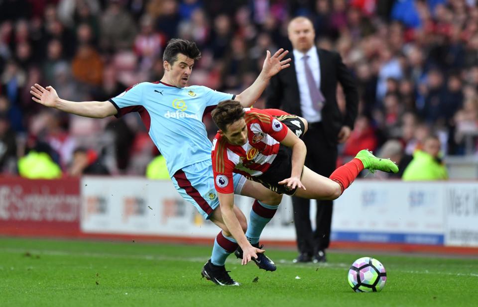  Sunderland's Adnan Januzaj in action with Burnley's Joey Barton as manager Sean Dyche looks on