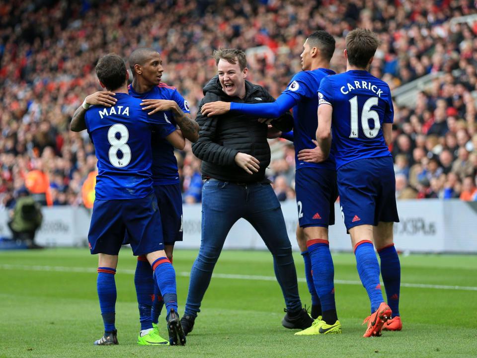  Pitch invader continues to celebrate as Man United eventually ran out 3-1 winners