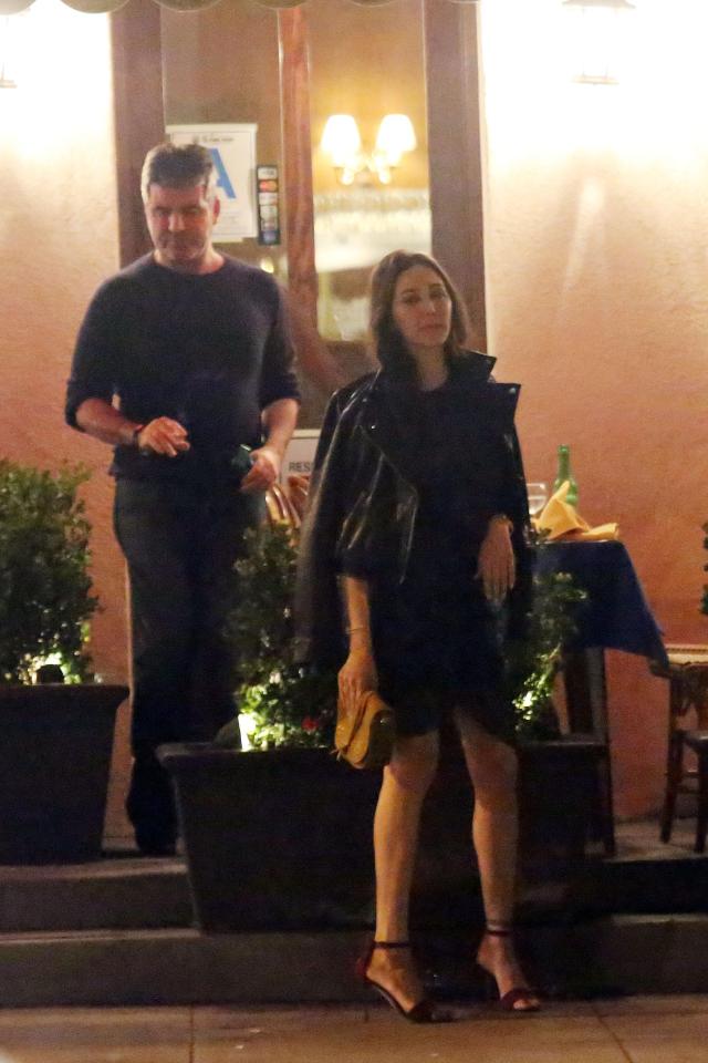  Lauren led the way as they left the restaurant, wearing a stylish LBD and stilettos