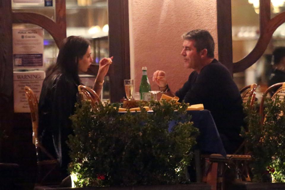  The couple looked lovingly at one another as they ate their meal