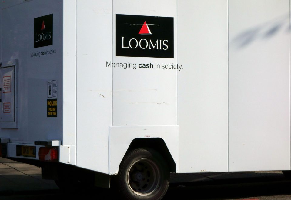  Two Loomis employees have been charged over the theft and cops are searching for other suspected thieves