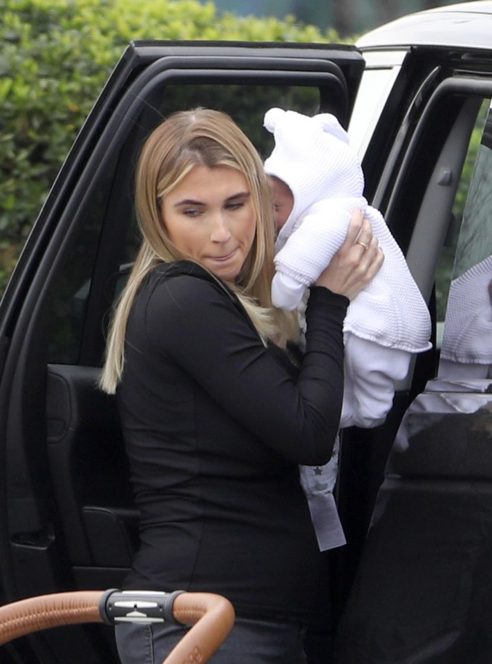 Billie Faiers held her baby up in her arms