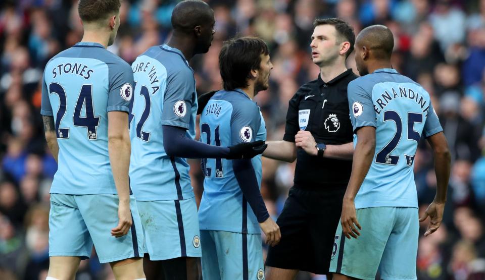  A number of Manchester City players surrounded Michael Oliver after the decision