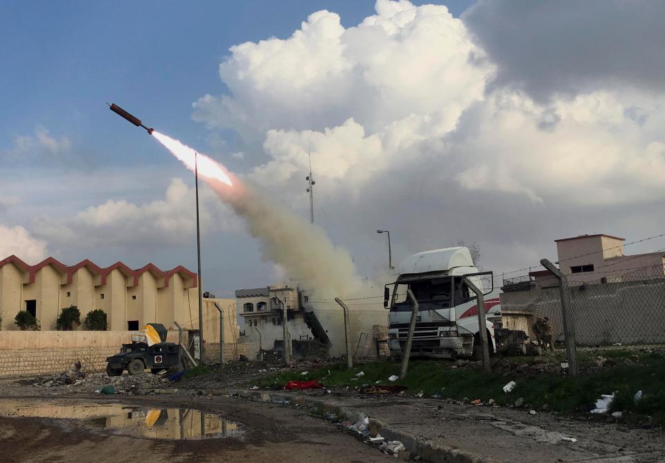  Iraqi security forces fire a rocket towards ISIS positions in Mosul