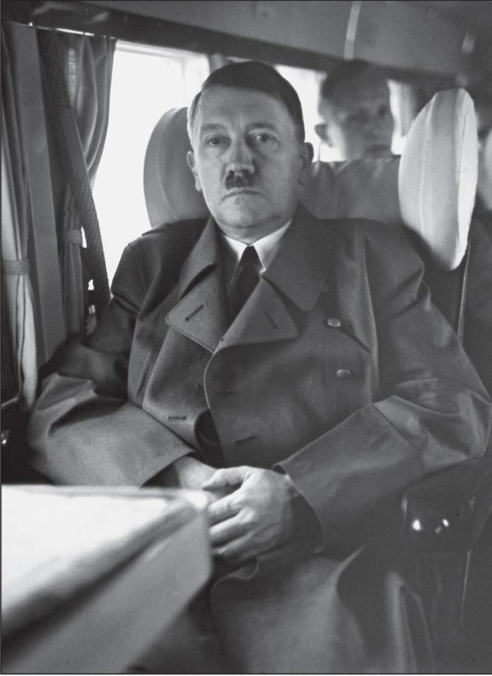  The pictures provide an intimate look at the inner circle of the Nazi party leadership. Here, Hitler sits on a train near his Alpine lair in Bertchesgarden