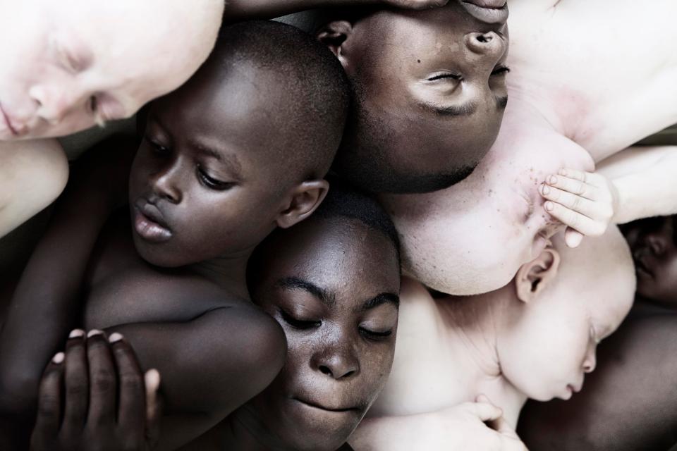  A group of boys huddle together for the striking photo project