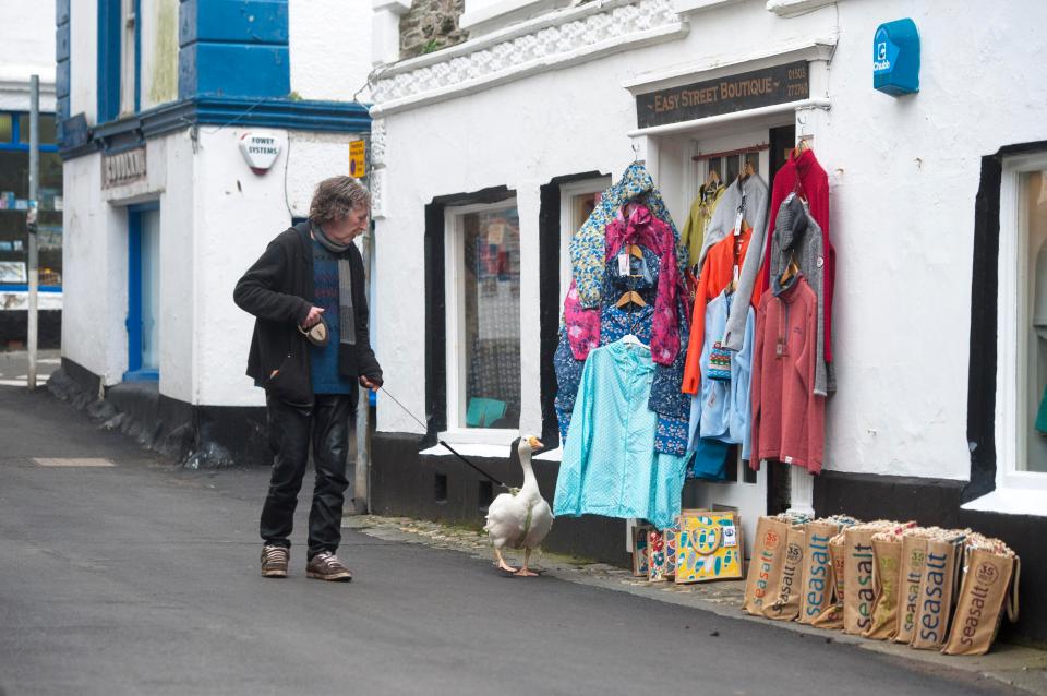  The odd pair browse shops as they stroll through the pretty village