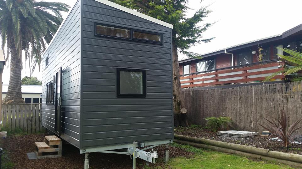  The tiny steel frame home has been built onto a trailer and contains a living room, bathrooms, kitchen and bedroom