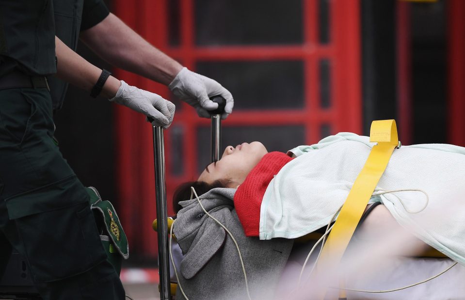  A woman is stretchered onto an ambulance after the attack