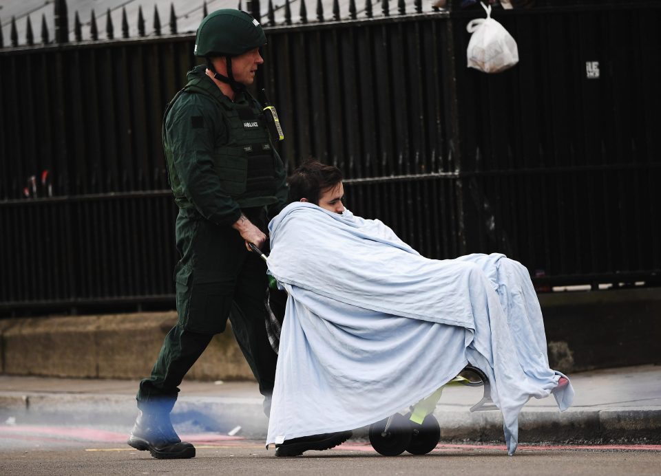  A member of the public is taken away for treatment by emergency services medic