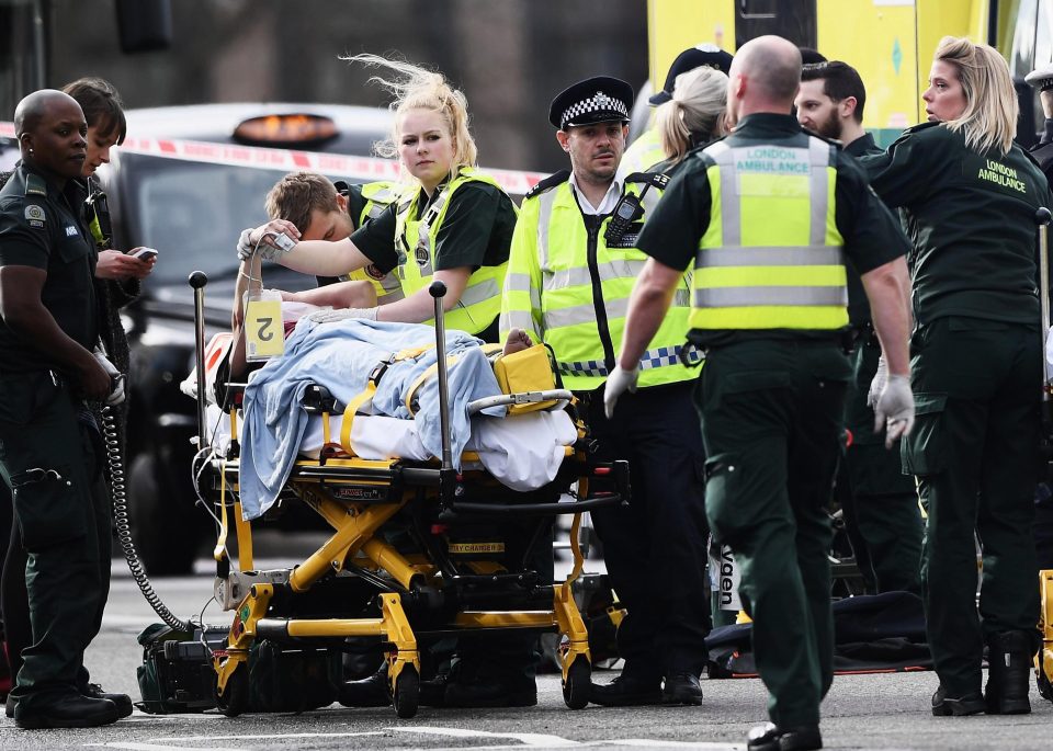  Paramedics rush to rescue one of the dozens injured on Westminster bridge