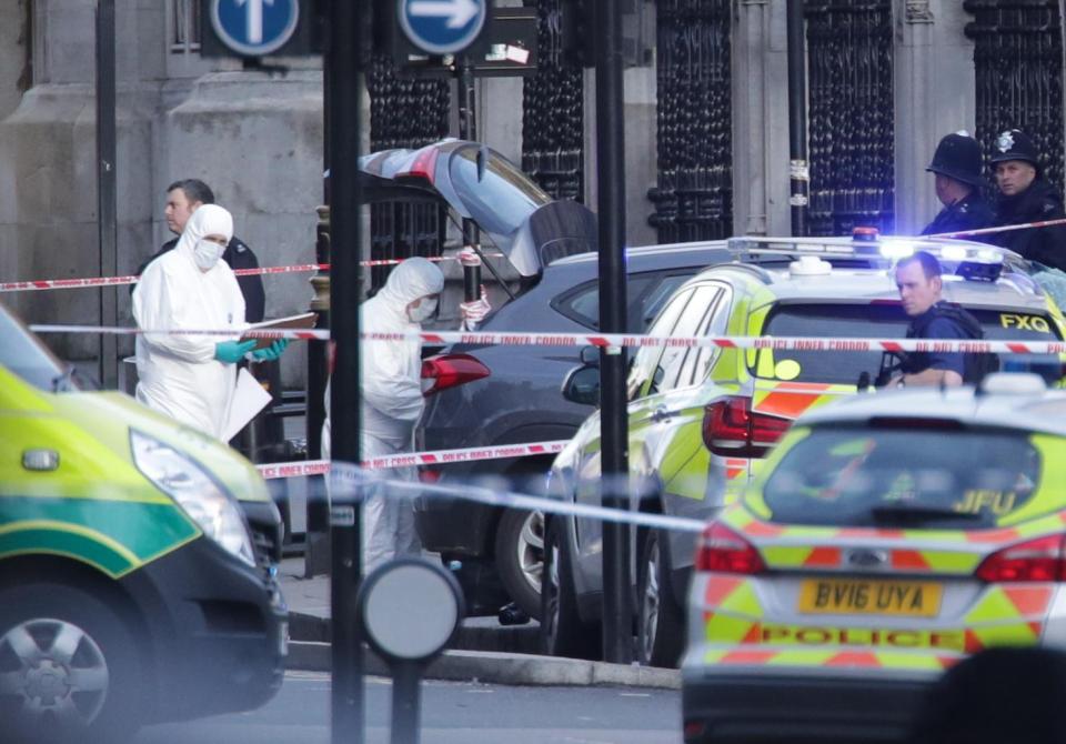  Forensic police officers work at the scene of the horrific attack