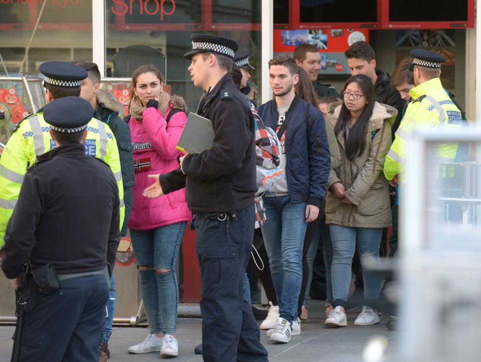  Tourists were calmly ushered out after spending almost three hours on the attraction as terror unfolded on streets below