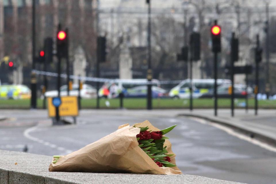  Roses are laid out near the scene of Wednesdays horror, which left three people dead and over forty injured