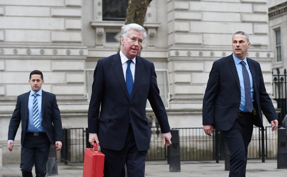  Defence Minister Michael Fallon (centre) leaves Downing Street following a briefing with Prime Minister Theresa May today