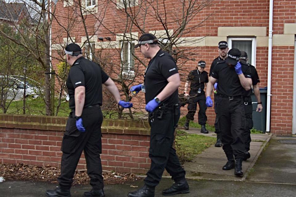  Swoop on old flat . . . Cops swoop in to collect evidence at Winson Green flat