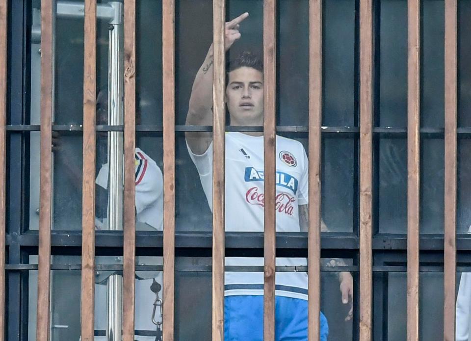  James Rodriguez appears to be upset by the journalists waiting outside the team hotel