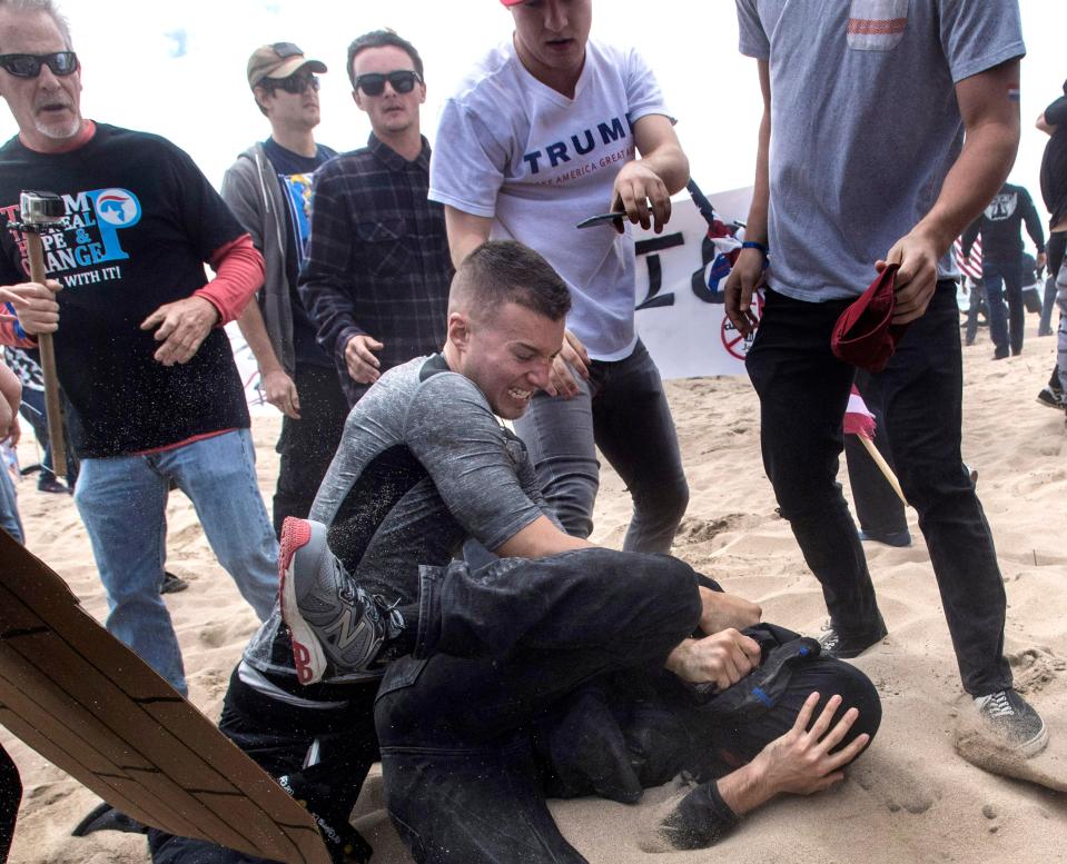 A Trump fan punches an anti-Trump activist in Huntingdon Beach, California 