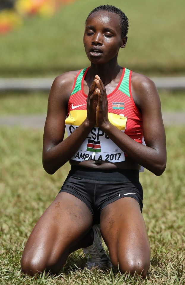  Celliphine Chepteek Chespol of Kenya says a prayer on the finish line